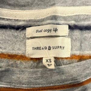 Thread and supply - long sleeve, light sweatshirt.